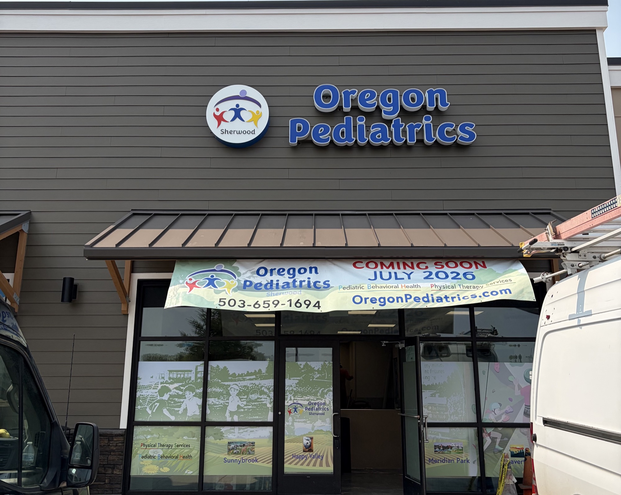 Oregon Pediatrics storefront signage on the completed Sherwood clinic